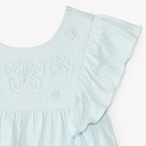 Tuniek met korte mouwen en volantjes en vlinderkoord voor meisjesbaby. 