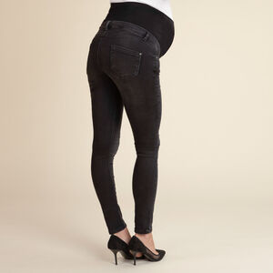 Skinny jeans voor zwangerschap met hoge hoofdband en used effect 