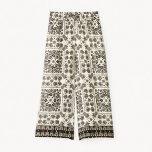 Flatterende, losjes zittende, bedrukte broek voor meisjes. 