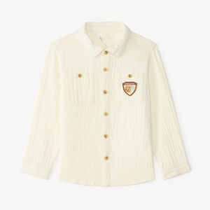 Langarmige babyjongen blouse van dubbele gaze met een fantasiebadge. 