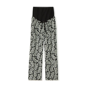 Wide and flowing pants with a high printed waistband for pregnant women. 