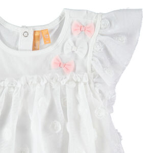 Feestelijk ensemble met tuniek van tule en plumetis en een witte legging 