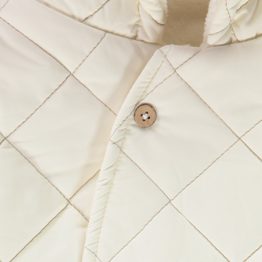 Combi-pilote matelassée à carreaux pour bébé avec finitions différentes selon l'âge 