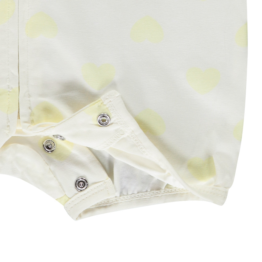 Combinaison courte imprimée cœurs jaunes pour bébé fille  