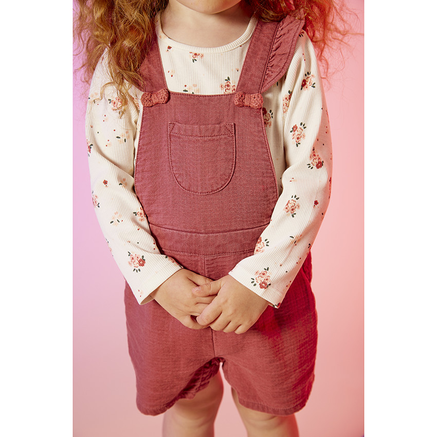 Korte gebreide salopette met knopen voor babymeisjes 