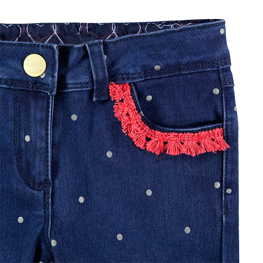 Jeans slim à pois all-over et franges contrastées 