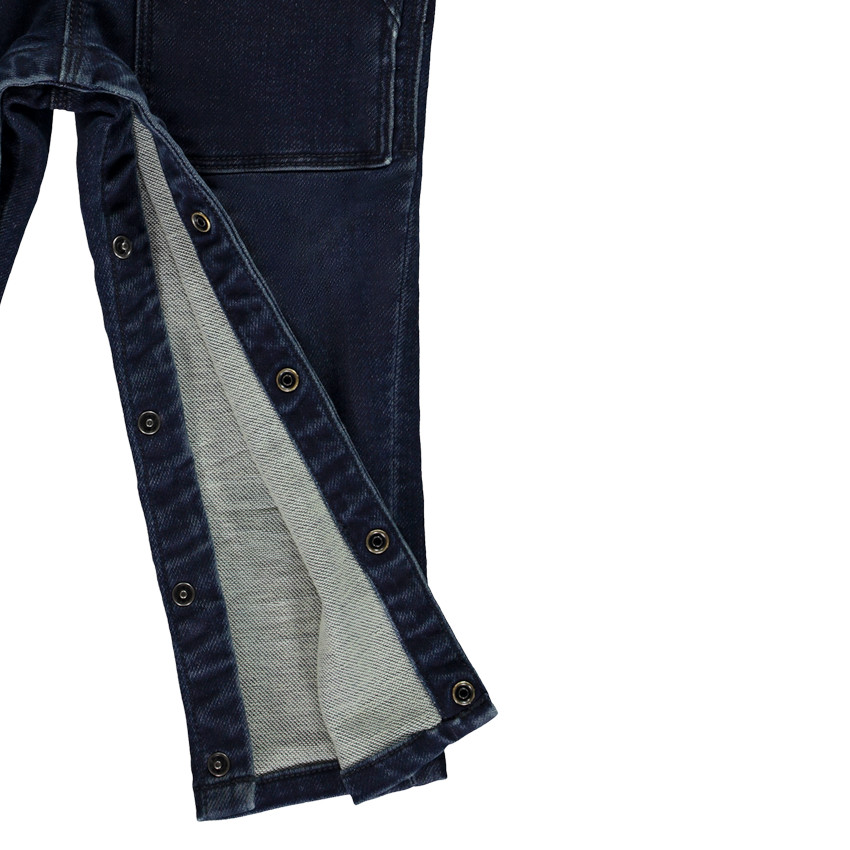 Lange jeanssalopette met dinosaurus badge voor baby jongen 