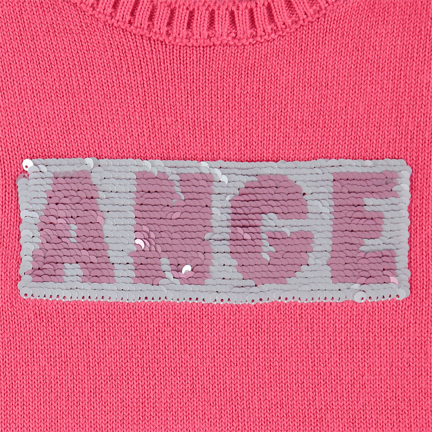 Pull en tricot avec message en sequins magiques 