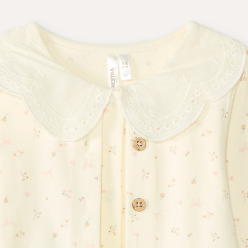 Tweedelig set voor baby meisjes: rompertje met vesteffect en legging. 