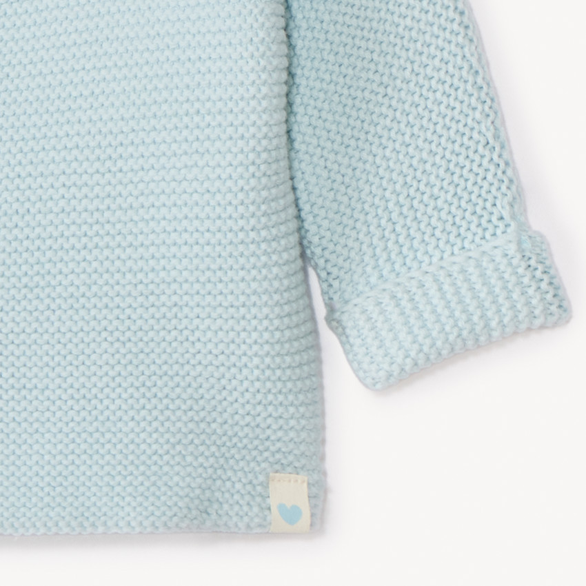Effen tricot babybustier in mousse ste stitch. 