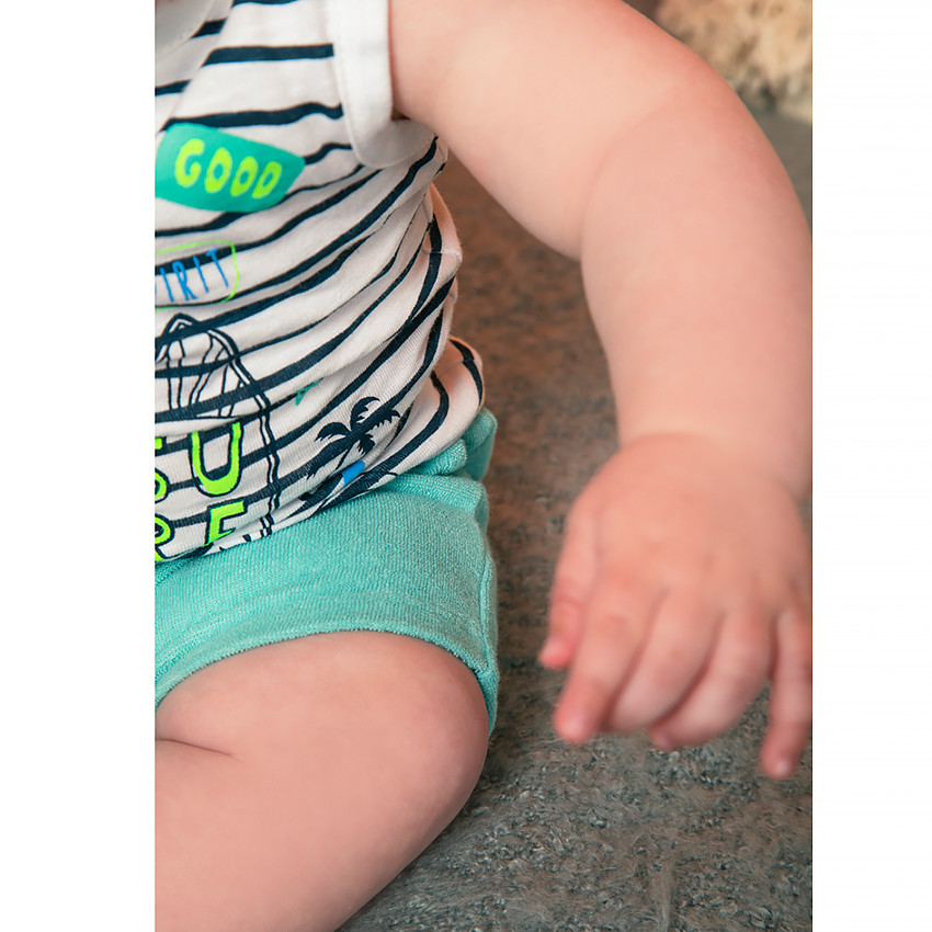 Gestreept topje van biokatoen met Smiley Baby-print 