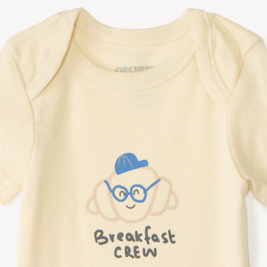 Set van 7 effen baby's rompers met fantasieprint 