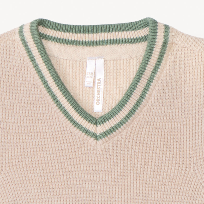 Mouwloos gebreid vest in effen kleur voor jongensbaby. 