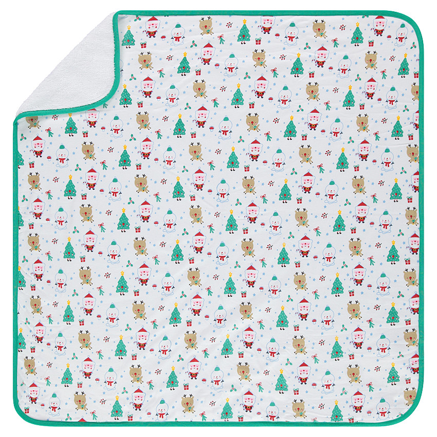Couverture en jersey et sherpa motif sapins et Pères Noël 