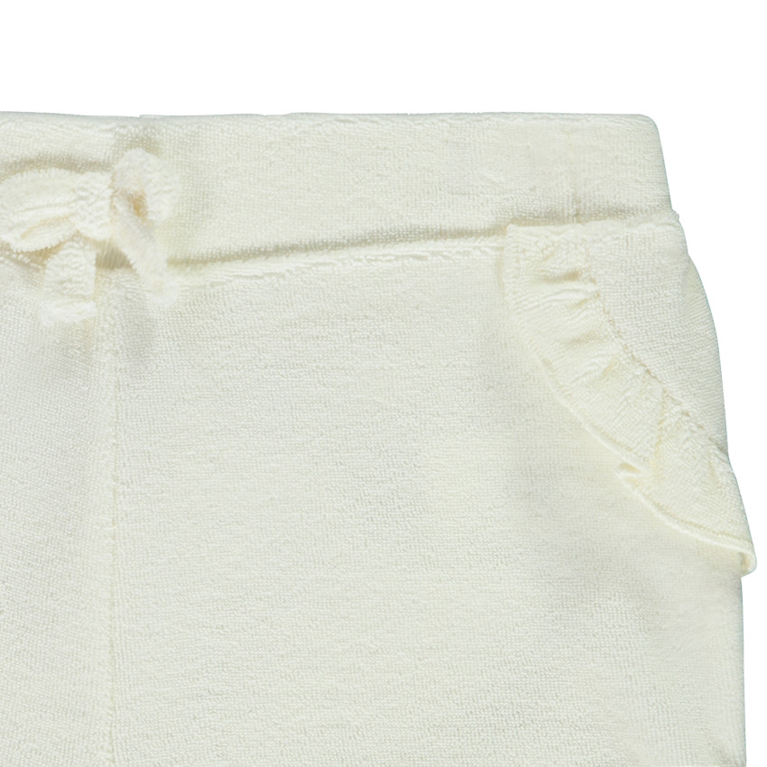 Effen short in badstof met ruches + strik voor baby meisje 